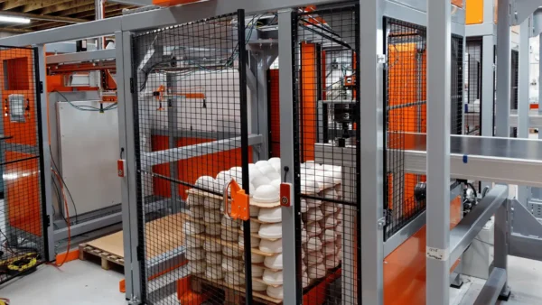 The first gantry system removes the wooden board from thestacked pottery Gantry system for pottery glazing showing Rollon Smart actuators