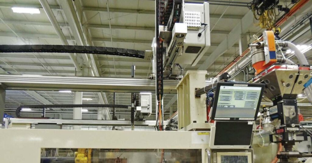 Attuatori Rollon per lautomazione dello stampaggio plastico Robôs industriais
