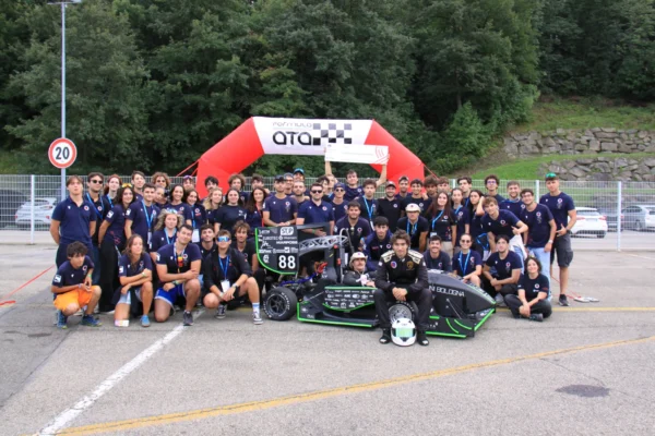 UniBo Motorsport team poses with the Albirea hybrid Formula SAE race car at the Formula ATA competition.